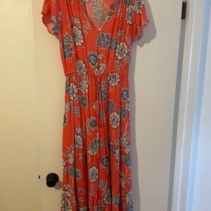 Floral, orangish/pink with blue flowers. Flowy and like new. Sonoma brand in XL